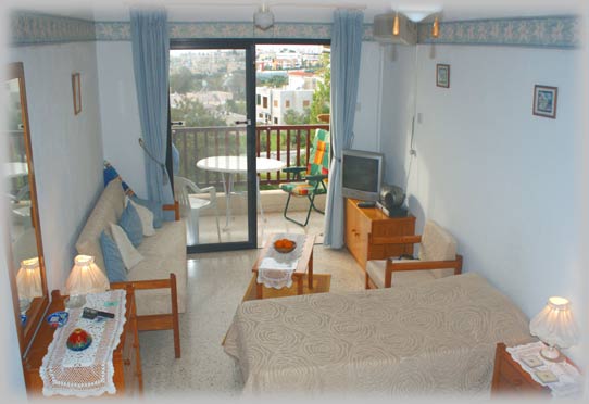 The comfortable relaxation space with balcony beyond.